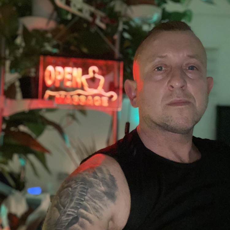 Selfie of me, Pete Seltik in my studio with wall art illuminated
