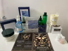 Desk in my studio with flower, products and my flyer